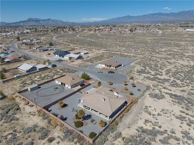 bird's eye view with a residential view, a mountain view, and a desert view