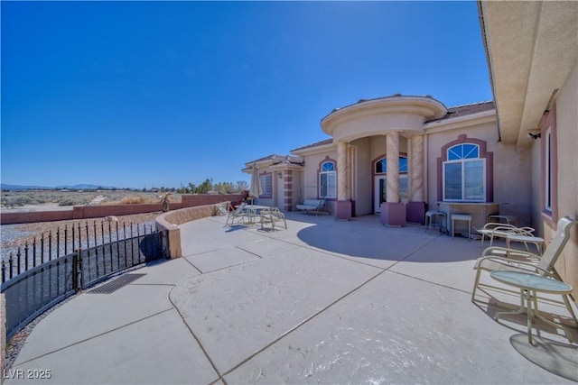 view of patio / terrace with fence