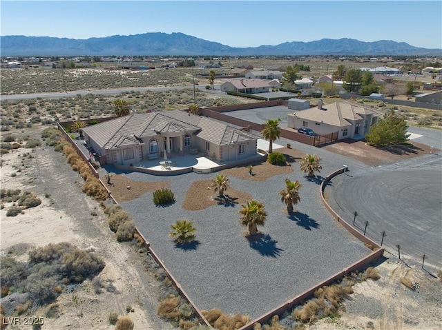 bird's eye view with a mountain view and view of desert