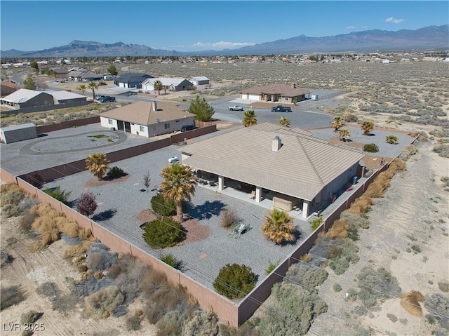 birds eye view of property featuring a mountain view and a residential view