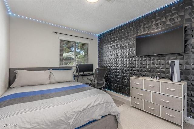 bedroom featuring light carpet and a textured ceiling