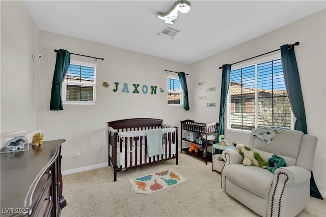 bedroom featuring carpet flooring, baseboards, visible vents, and multiple windows