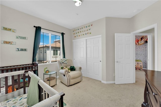 bedroom featuring carpet, a closet, and baseboards