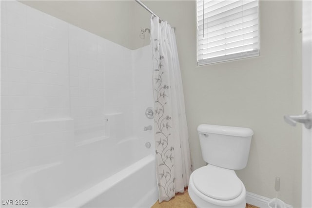 full bath featuring toilet and shower / bath combination with curtain