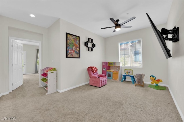 game room featuring baseboards, a ceiling fan, and carpet floors