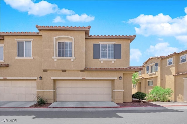 multi unit property featuring stucco siding, a tiled roof, and a garage