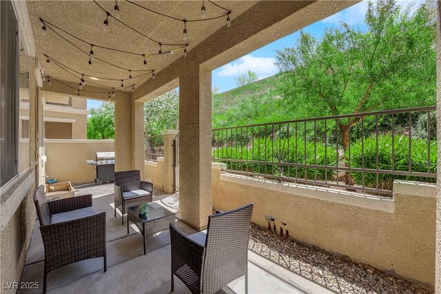 view of patio featuring grilling area and outdoor lounge area