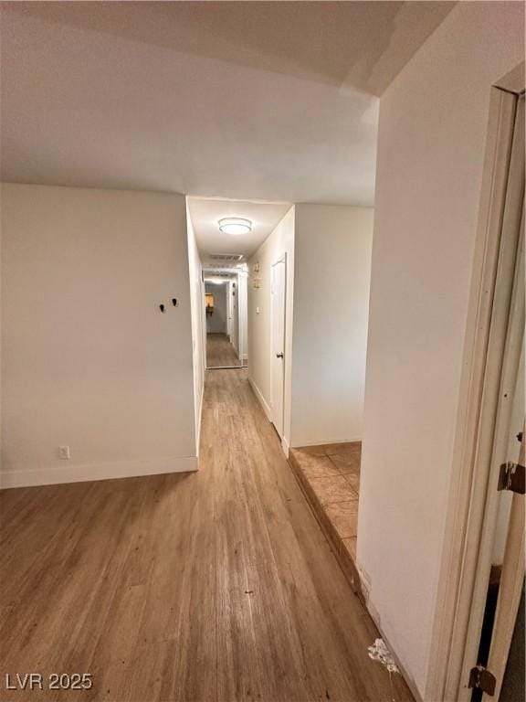 6460 Linda Ln, Las Vegas, NV 89103 - hallway with light wood finished floors and baseboards