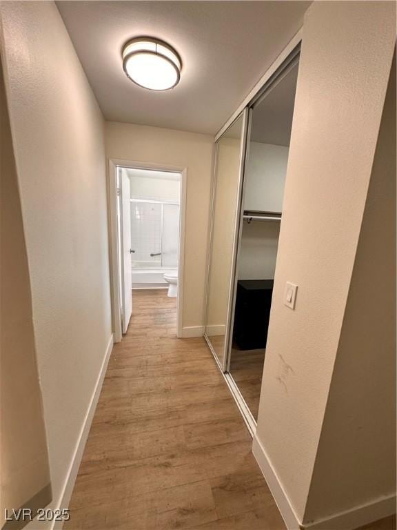6460 Linda Ln, Las Vegas, NV 89103 - hallway featuring baseboards and light wood-style floors