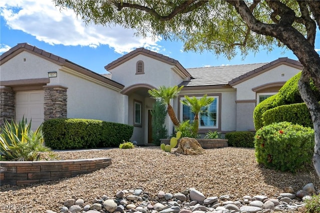 1613 Williamsport St, Henderson, NV 89052 - view of front facade with an attached garage, stucco siding, and a tile roof