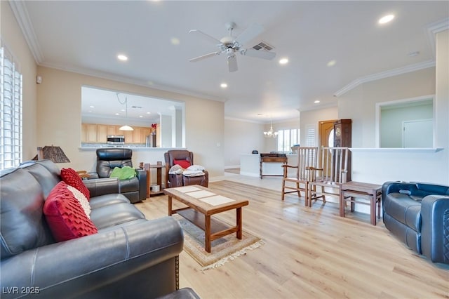 1613 Williamsport St, Henderson, NV 89052 - living room featuring ornamental molding, a ceiling fan, light wood finished floors, a chandelier, and recessed lighting