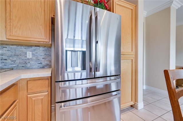 1613 Williamsport St, Henderson, NV 89052 - kitchen with stainless steel fridge with ice dispenser, crown molding, light tile patterned floors, light brown cabinetry, and light countertops