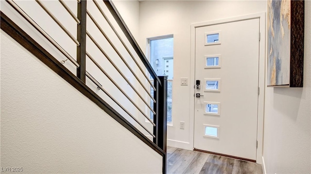 1157 Blossom Point St, Las Vegas, NV 89135 - foyer entrance with stairway, baseboards, and wood finished floors