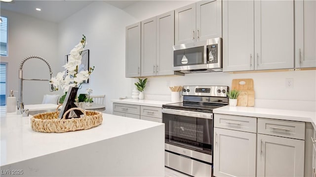 1157 Blossom Point St, Las Vegas, NV 89135 - kitchen with light countertops, stainless steel appliances, and recessed lighting
