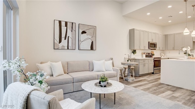 1157 Blossom Point St, Las Vegas, NV 89135 - living area with light wood-style floors and recessed lighting
