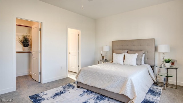 1157 Blossom Point St, Las Vegas, NV 89135 - bedroom featuring baseboards, carpet floors, and a walk in closet