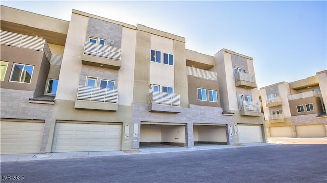 1157 Blossom Point St, Las Vegas, NV 89135 - view of building exterior with a garage