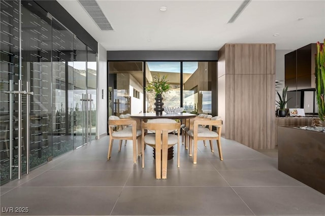 12 Chisel Crest Ct, Henderson, NV 89012 - dining area with tile patterned floors, expansive windows, and visible vents