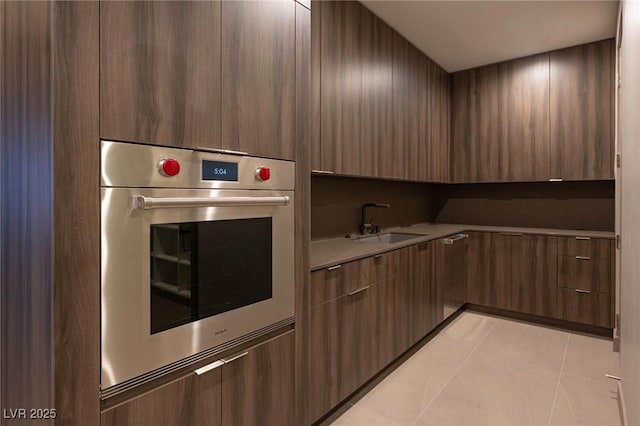 12 Chisel Crest Ct, Henderson, NV 89012 - kitchen featuring a sink, oven, light tile patterned flooring, and modern cabinets