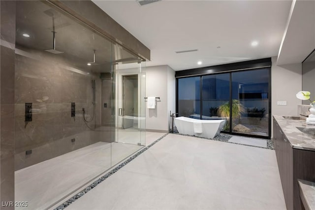 12 Chisel Crest Ct, Henderson, NV 89012 - bathroom featuring a soaking tub, tile patterned flooring, a shower stall, vanity, and recessed lighting