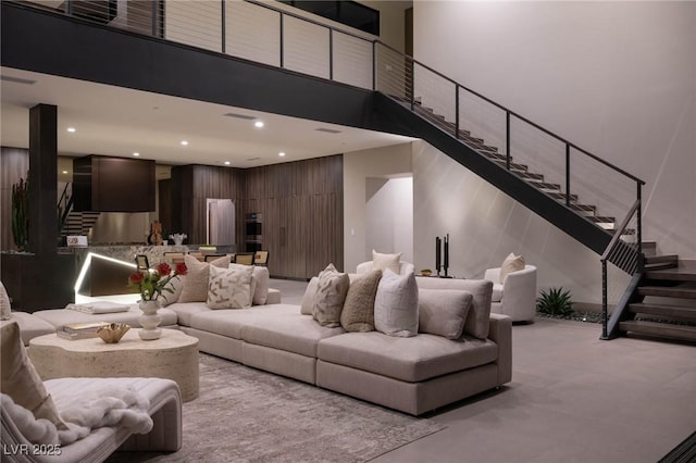 12 Chisel Crest Ct, Henderson, NV 89012 - living area featuring stairs, a high ceiling, and recessed lighting