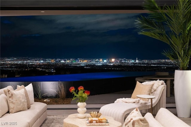 12 Chisel Crest Ct, Henderson, NV 89012 - balcony at night featuring a patio area and a view of city lights