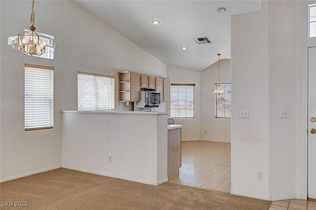kitchen featuring open shelves, an inviting chandelier, visible vents, and light colored carpet
