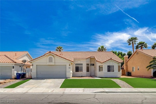 mediterranean / spanish home featuring driveway, an attached garage, stucco siding, a tile roof, and a front lawn