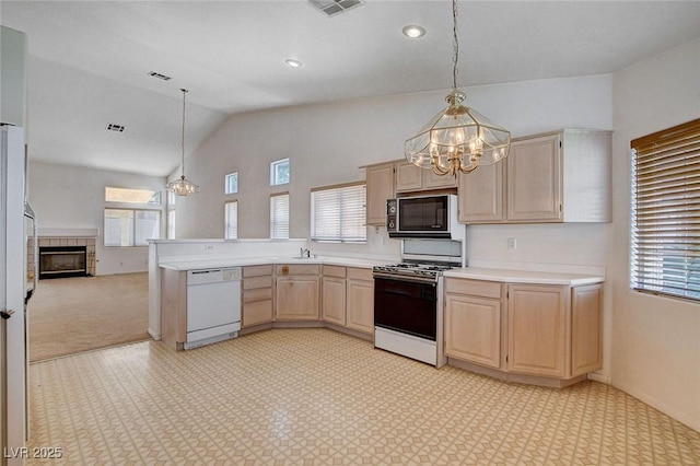 kitchen with white dishwasher, a notable chandelier, light brown cabinetry, and range with gas cooktop