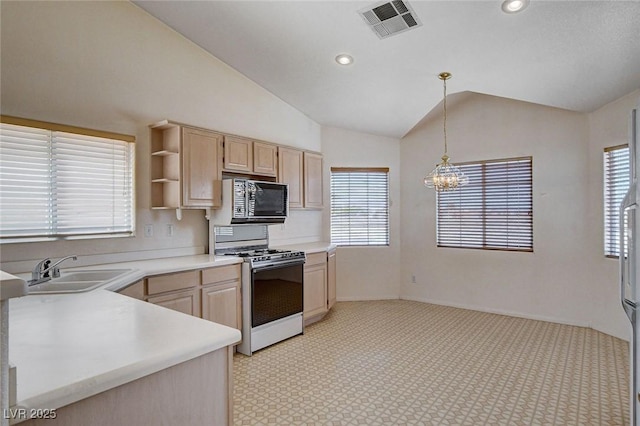 kitchen with a sink, visible vents, gas stove, black microwave, and light brown cabinets