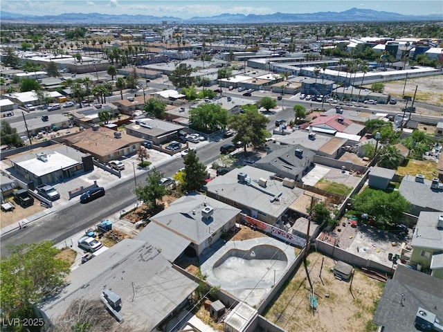 birds eye view of property with a mountain view and a residential view