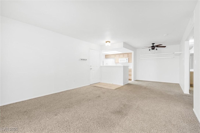 1900 Mountain Hills Ct Unit 203, Las Vegas, NV 89128 - unfurnished living room with light colored carpet and ceiling fan