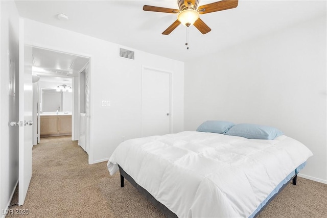 1900 Mountain Hills Ct Unit 203, Las Vegas, NV 89128 - bedroom featuring light colored carpet, baseboards, ceiling fan, and visible vents