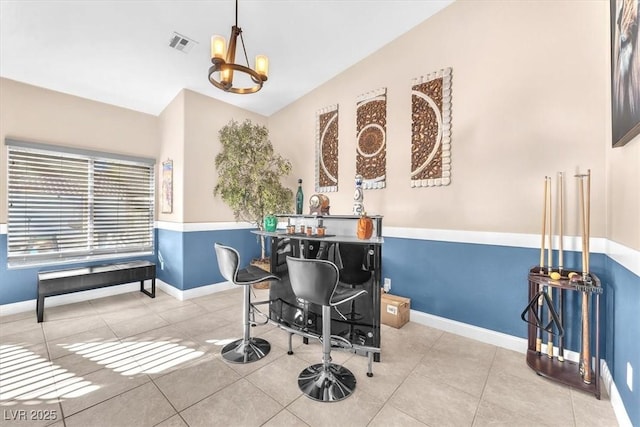 10113 Walhalla Plateau Ct, Las Vegas, NV 89148 - tiled office space with a chandelier, vaulted ceiling, and baseboards