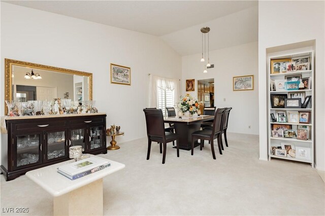 1528 Tonada Way, Las Vegas, NV 89117 - dining room featuring lofted ceiling, carpet, and a chandelier