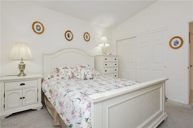 1528 Tonada Way, Las Vegas, NV 89117 - bedroom with light carpet, a closet, and lofted ceiling