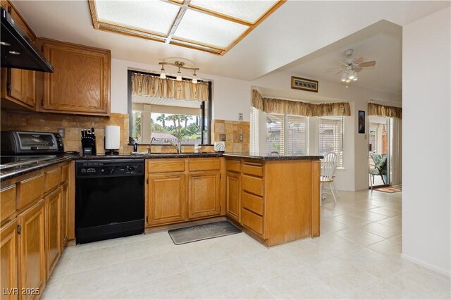 1528 Tonada Way, Las Vegas, NV 89117 - kitchen with black dishwasher, wall chimney range hood, a sink, a peninsula, and decorative backsplash