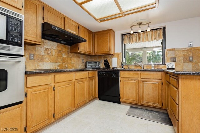 1528 Tonada Way, Las Vegas, NV 89117 - kitchen with black appliances, exhaust hood, a sink, tasteful backsplash, and dark stone counters