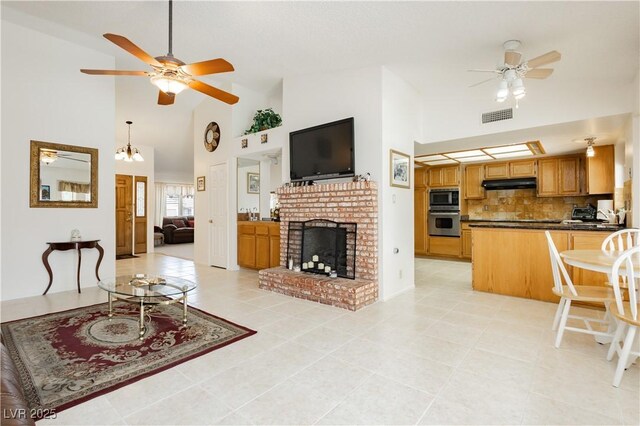 1528 Tonada Way, Las Vegas, NV 89117 - living room featuring ceiling fan, high vaulted ceiling, light tile patterned floors, and a fireplace