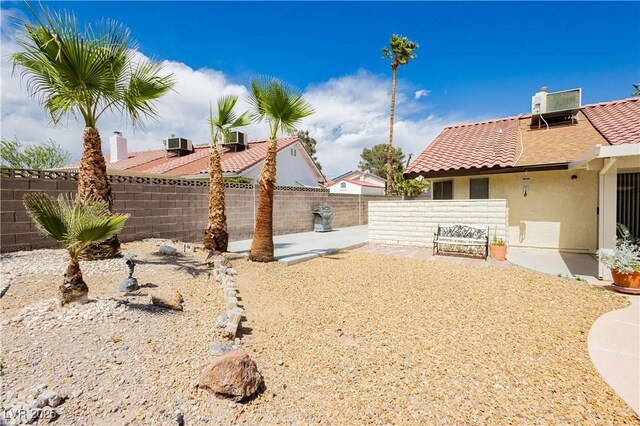 1528 Tonada Way, Las Vegas, NV 89117 - fenced backyard featuring cooling unit and a patio area