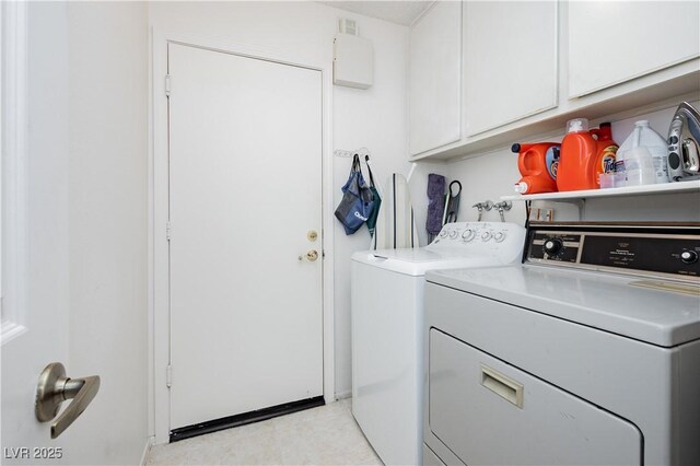1528 Tonada Way, Las Vegas, NV 89117 - washroom featuring independent washer and dryer, cabinet space, and light tile patterned floors