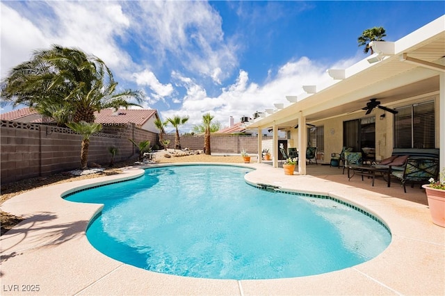view of swimming pool featuring a fenced backyard, ceiling fan, a patio area, and a fenced in pool
