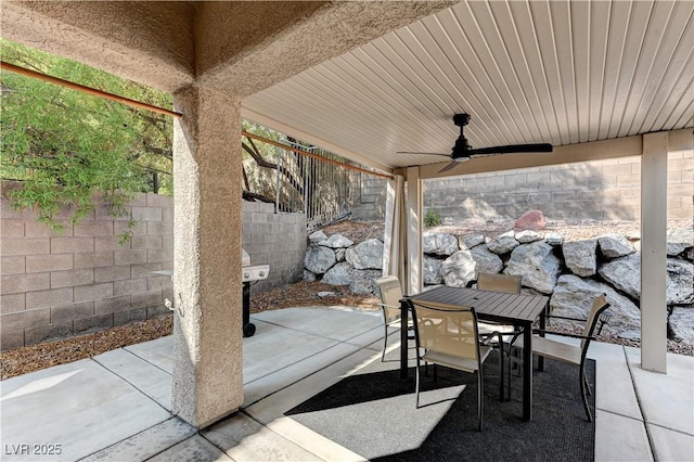 view of patio / terrace featuring outdoor dining space, ceiling fan, and a fenced backyard