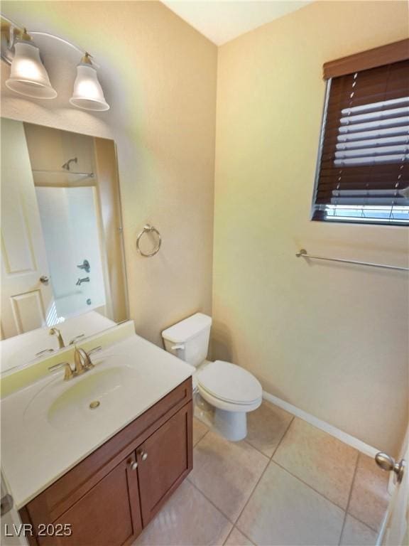 10331 Northern Hills Ave, Las Vegas, NV 89166 - bathroom with toilet, baseboards, tile patterned flooring, and vanity