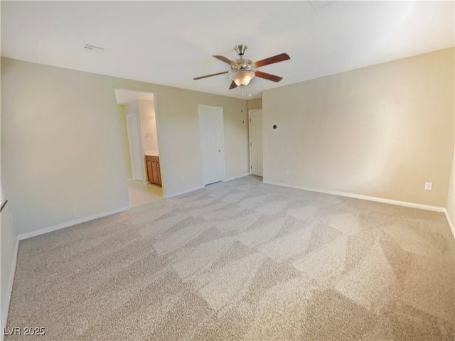 10331 Northern Hills Ave, Las Vegas, NV 89166 - unfurnished bedroom featuring ensuite bath, light colored carpet, baseboards, and ceiling fan