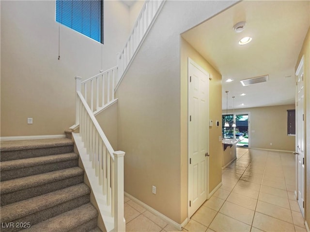 10331 Northern Hills Ave, Las Vegas, NV 89166 - stairs featuring tile patterned flooring, baseboards, visible vents, and recessed lighting