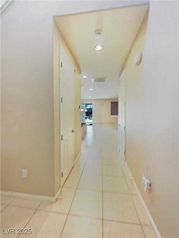 10331 Northern Hills Ave, Las Vegas, NV 89166 - hallway featuring light tile patterned floors, baseboards, and recessed lighting