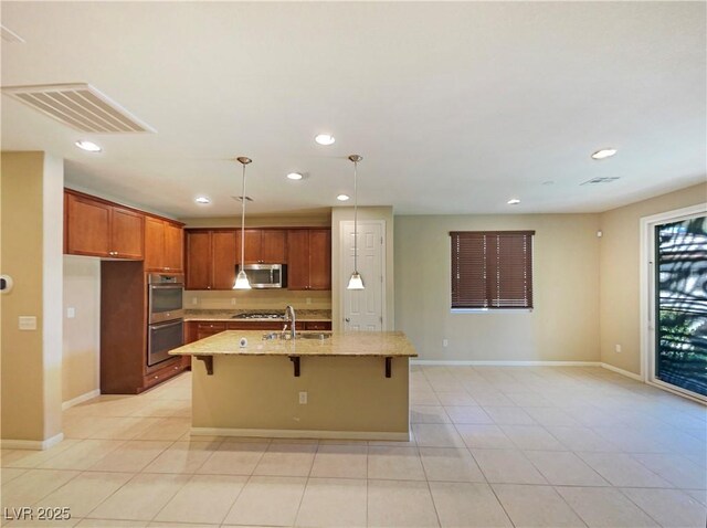 10331 Northern Hills Ave, Las Vegas, NV 89166 - kitchen featuring recessed lighting, visible vents, appliances with stainless steel finishes, and a breakfast bar
