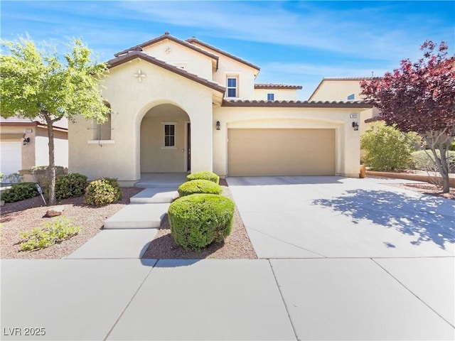 10331 Northern Hills Ave, Las Vegas, NV 89166 - mediterranean / spanish house featuring an attached garage, stucco siding, driveway, and a tile roof