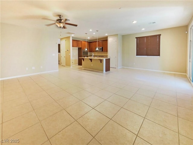 10331 Northern Hills Ave, Las Vegas, NV 89166 - unfurnished living room with baseboards, a ceiling fan, light tile patterned floors, and recessed lighting